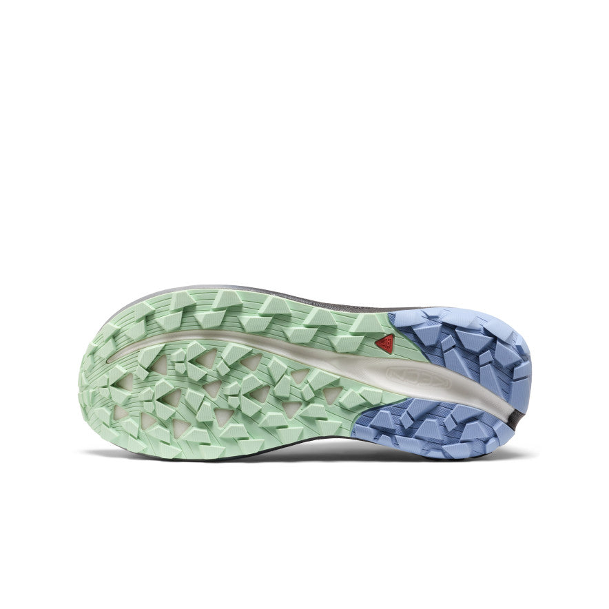 The sole of a salomon x ultra 3 trail running shoe with mint green and light blue rubber outsole and geometric tread pattern