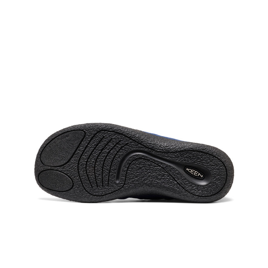 Black rubber sole with textured grip and keen logo on the back side of men's howser ii naval
