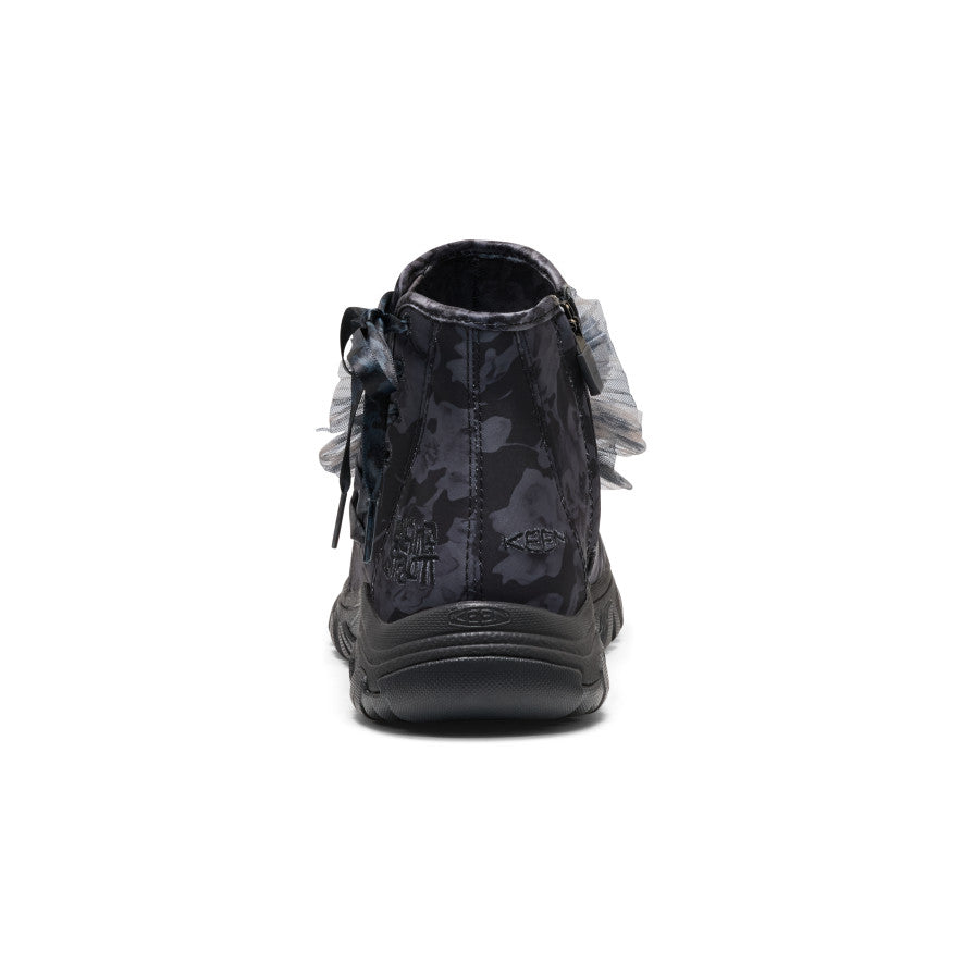 A single black and dark gray camouflage high-top shoe shown from the back on a white background.
