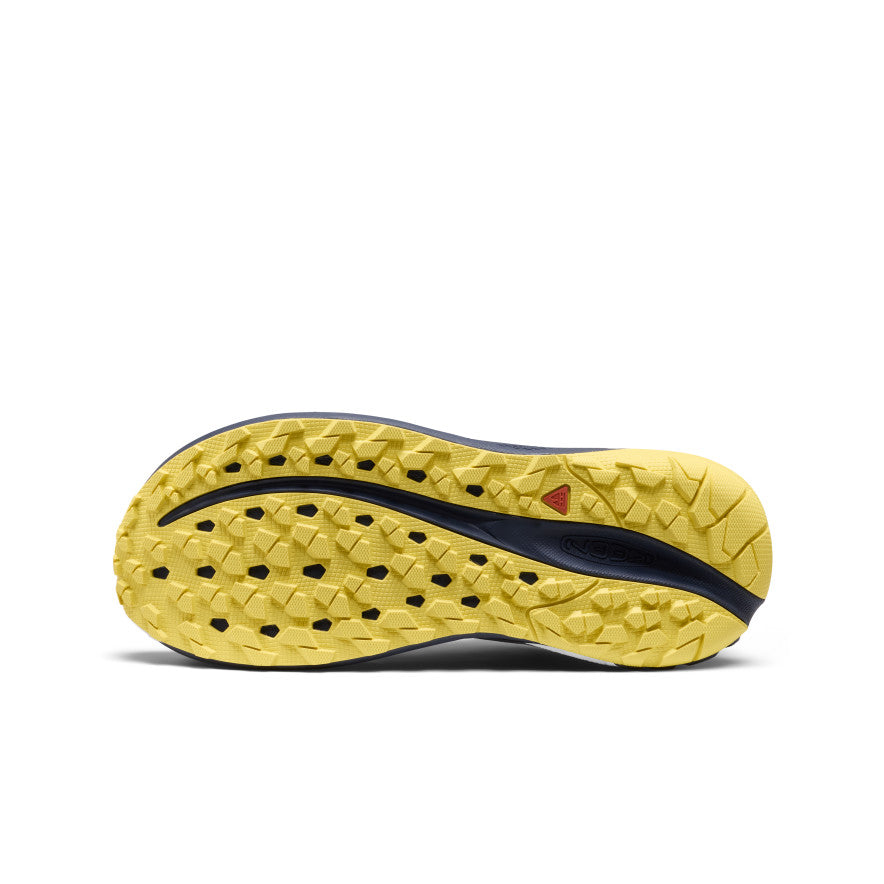 Yellow and navy blue outsole of nike women's roam waterproof trail running shoe with textured