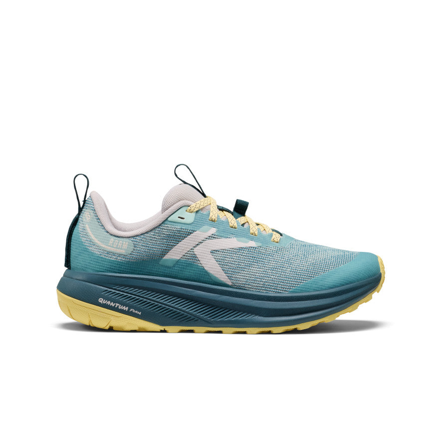Women's Roam trail running shoe in teal and yellow with mesh upper black pull tabs and quantum foam