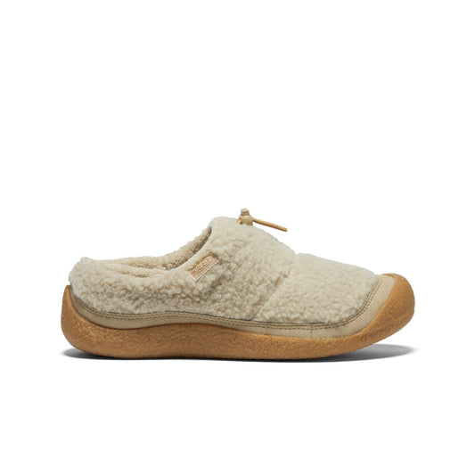 Cream sherpa fleece slip-on slipper with gum rubber sole, side profile