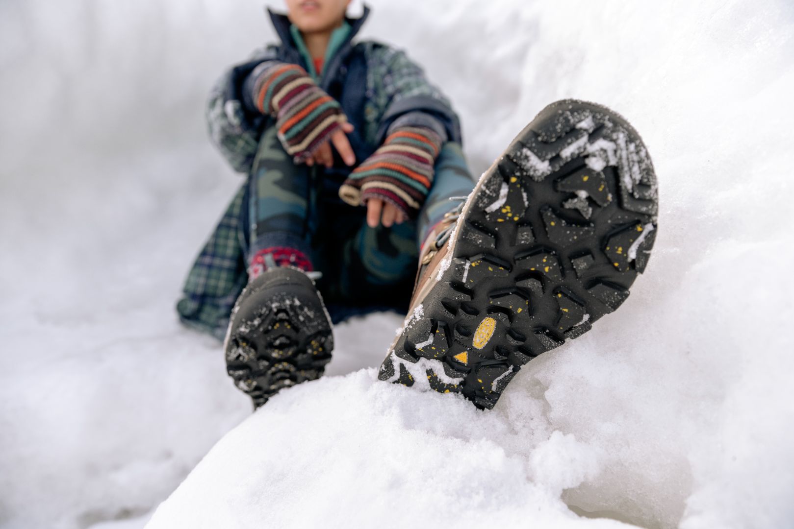 Close up of the sole of walking boots in snow