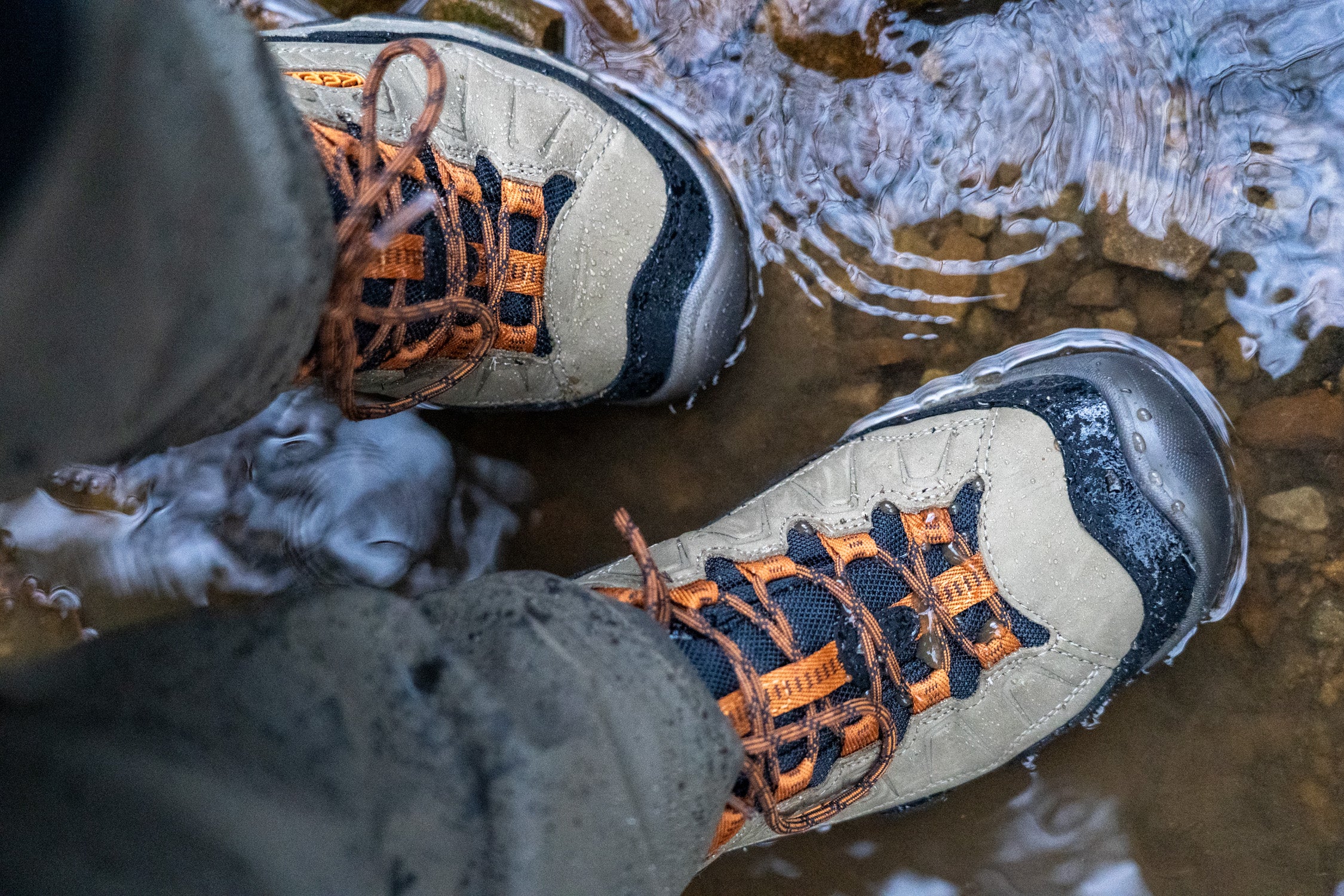 Walking boots standing in a puddle of water