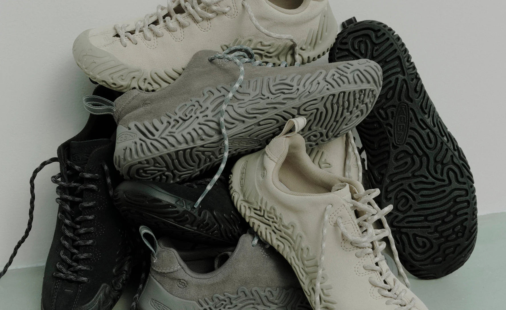 Stack of various sneakers on a white background