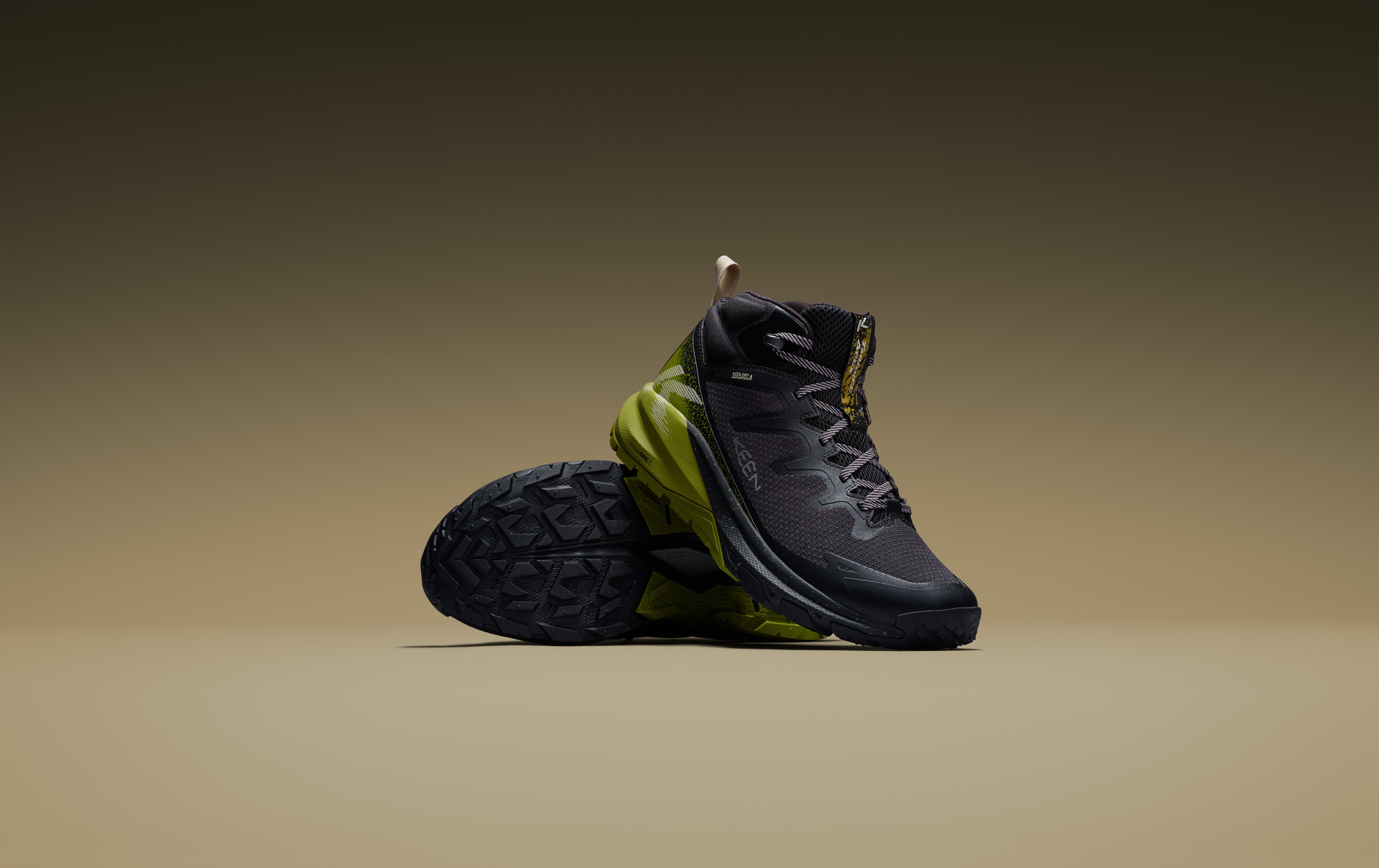 picture of black targhee apex hiking boots in front of a beige background 