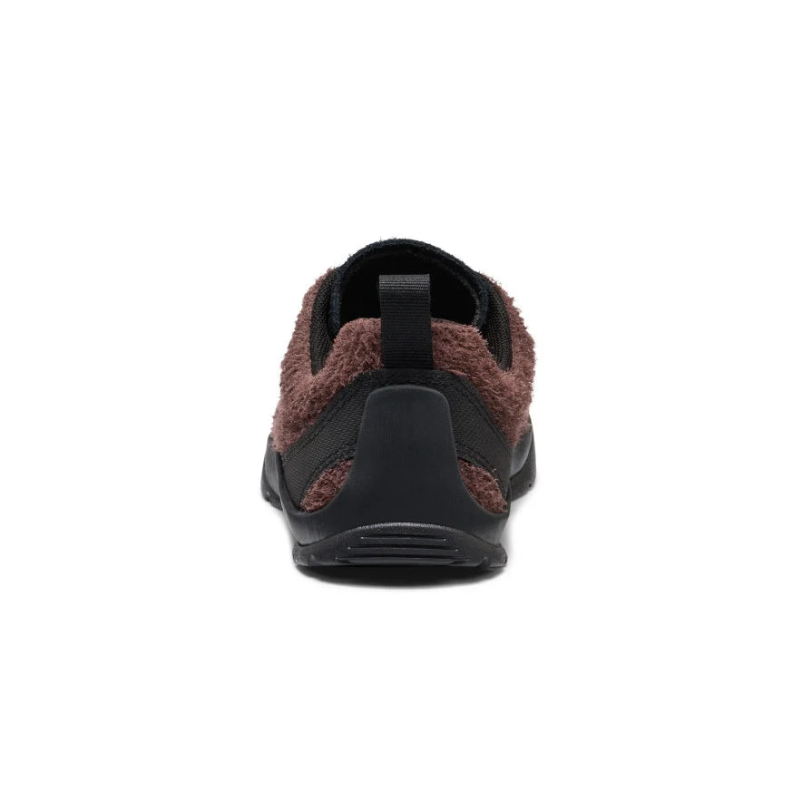 The back of a Black and brown sneaker on a white background