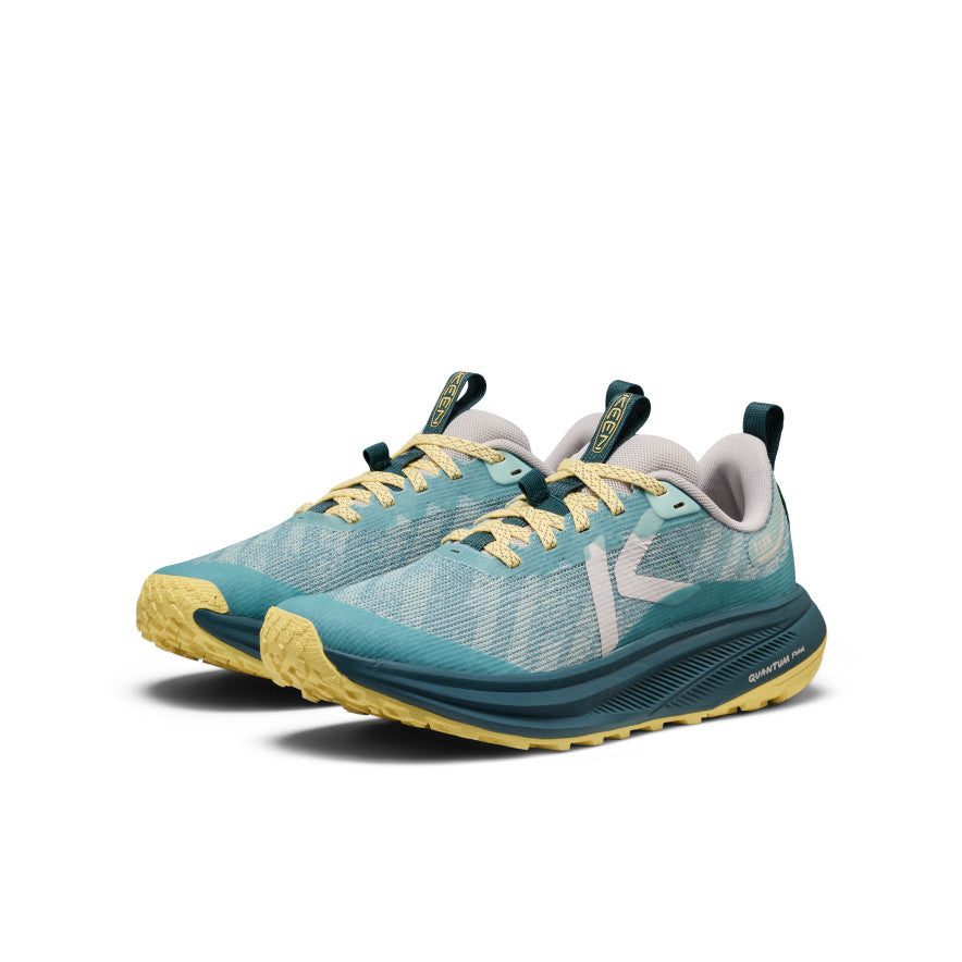 Women's roam trail running shoe in aquifer and mediterranea colors with breathable mesh upper