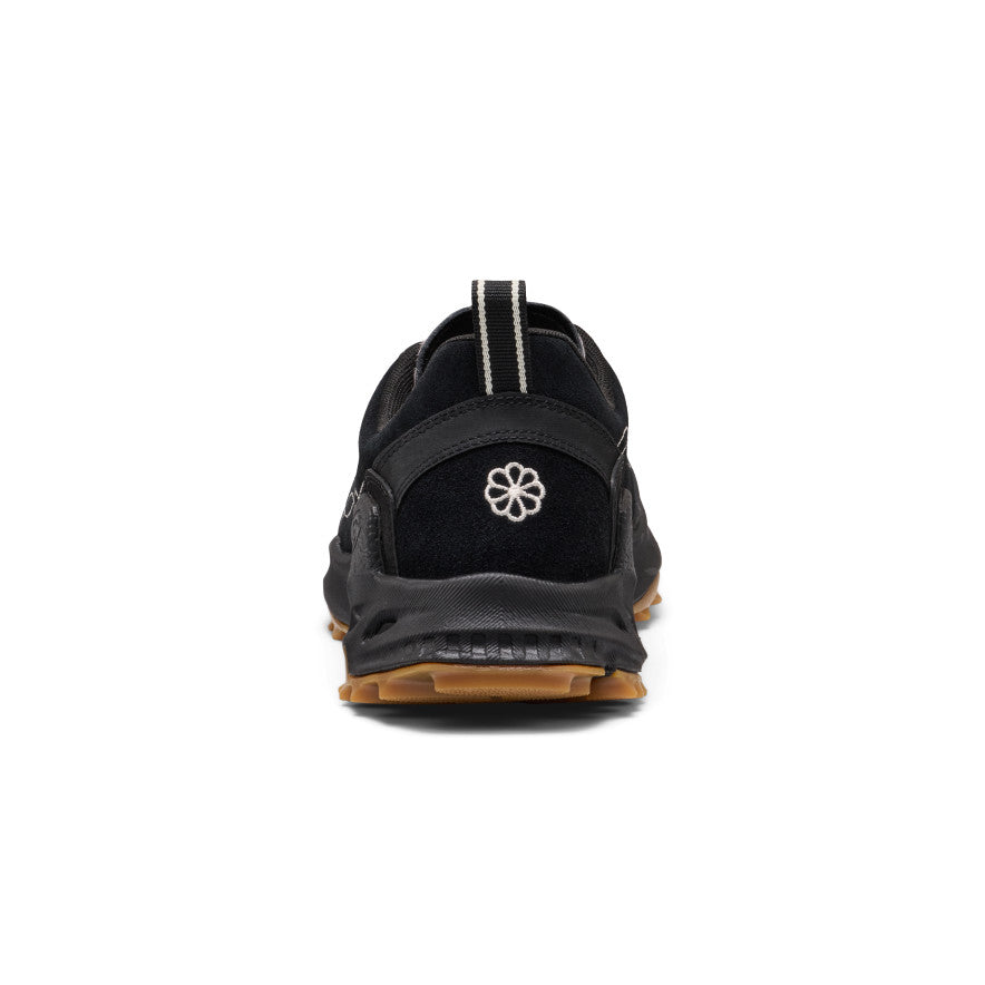 Back view of men's Jasper Zionic black athletic sneaker with textured rubber sole and white