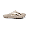 Beige rubber slip-on women's shanti clog with textured molded design and circular cutouts in plaza