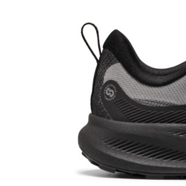 Close-up side view of a black and gray athletic shoe showing the heel, collar, pull tab