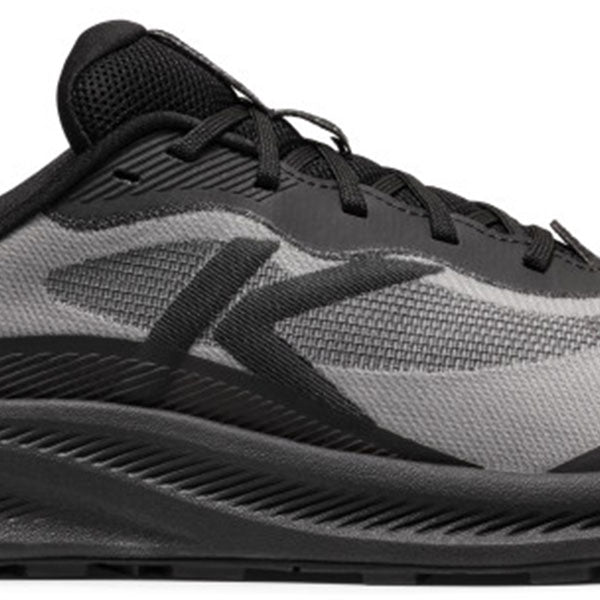 A close-up side view of a black and gray athletic running shoe, showing the textured mesh upper