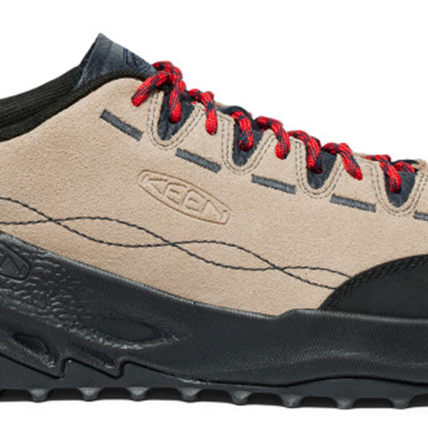 A close-up side view of a KEEN hiking shoe in beige suede with a black sole and red laces